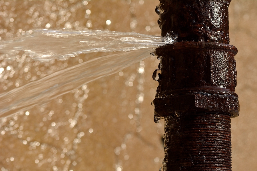 Rusty burst pipe leaking water Rusty burst pipe leaking water